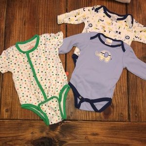 1 magnet onesie & 2 long sleeved carter onesies.